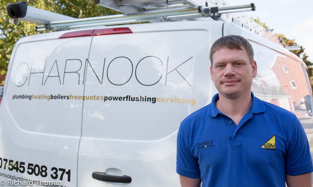 Mark Charnock beside the Charnock Plumbing & Heating van in Ealing